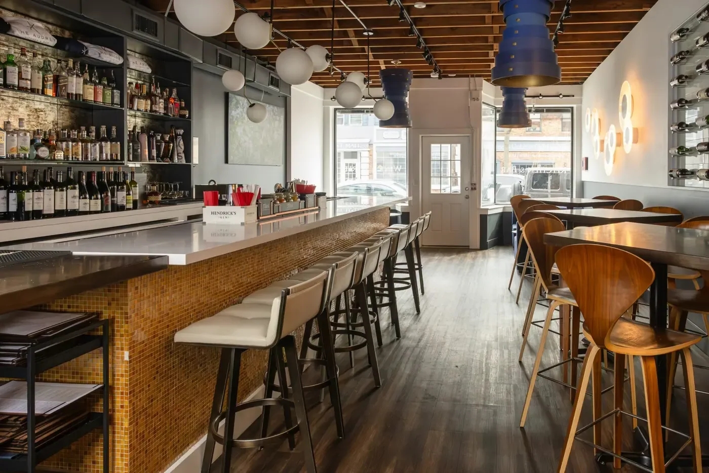 A long bar and dining room set before service