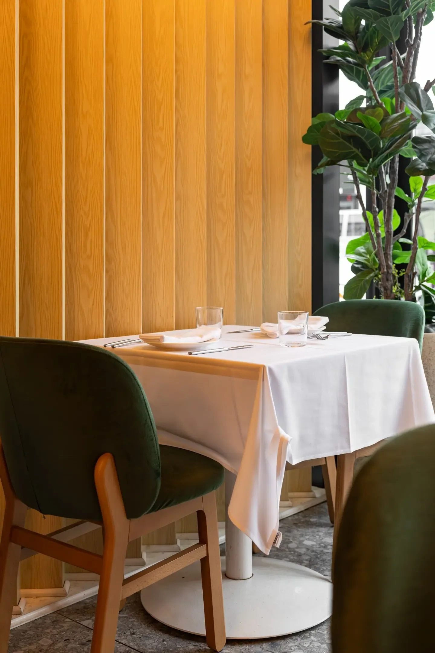 A corner table laid for a private dinner